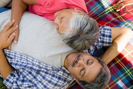 Senior couple laying on blanket to represent the blog Finding Intimacy